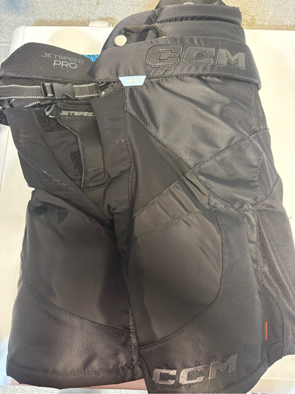 CCM Jetspeed Pro Black Hockey Pants with Blue Accents